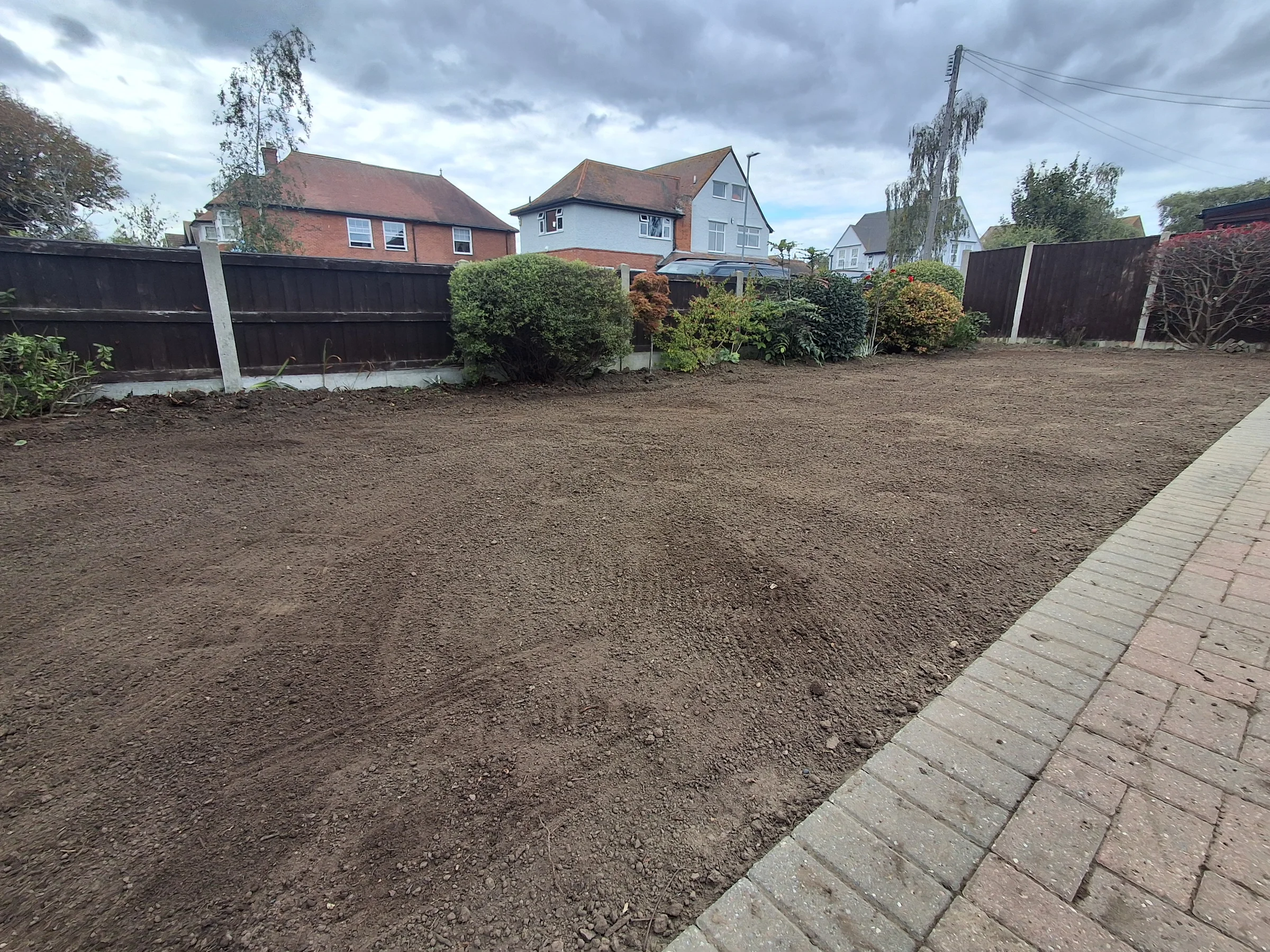 Raking out the fine soil flat and to the correct level